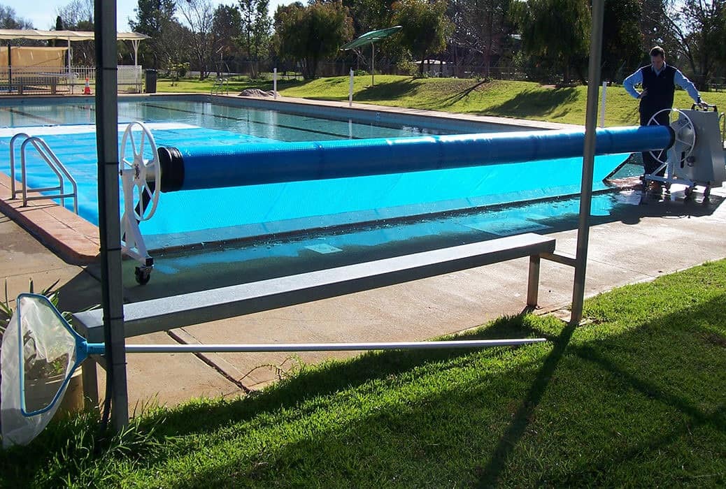 Commercial pool cover with roller