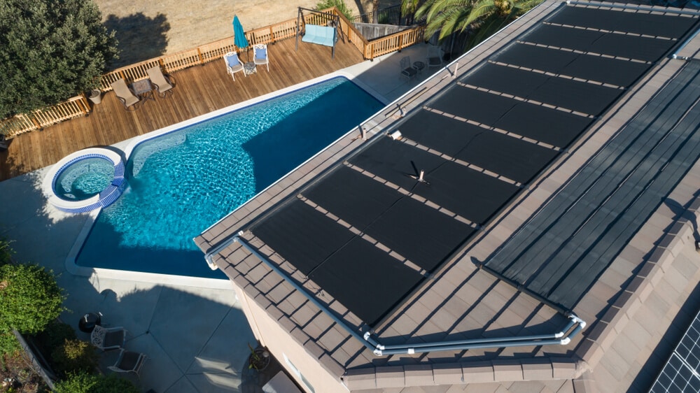 Thermal Solar Panels Installed on the Roof of a Large House - Solar Pool Heating: The Installation Process